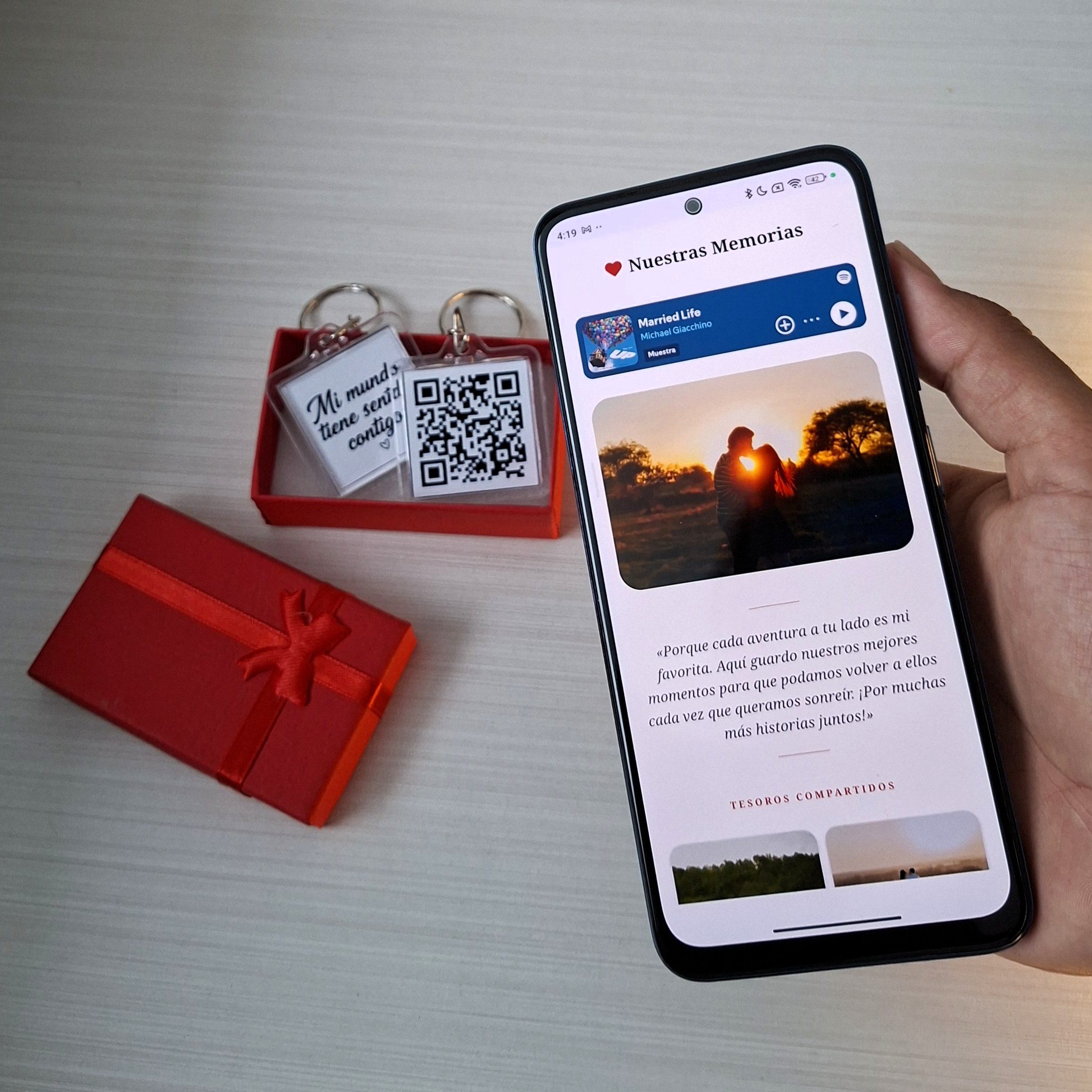 Person scanning a QR code keychain with a smartphone